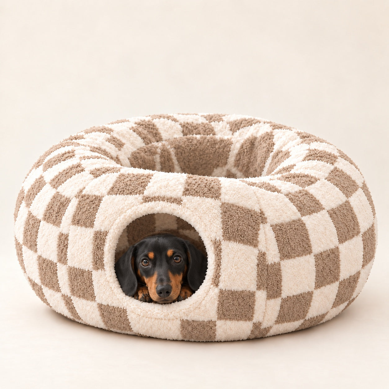 Black-and-tan Dachshund peeking out of a Sand Checker Burrow Bed