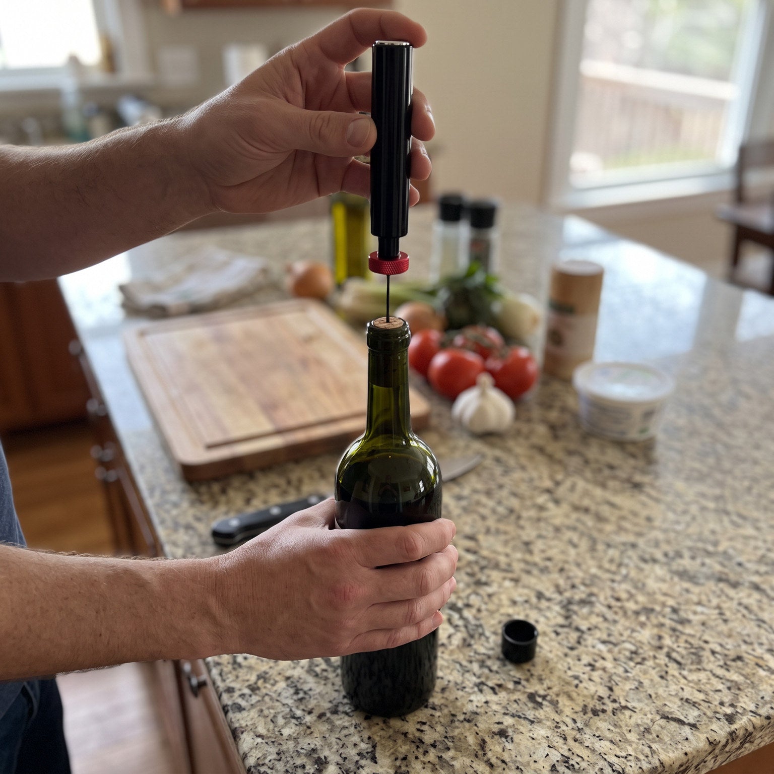 POV of a Red Openvale opener pumping at a kitchen counter
