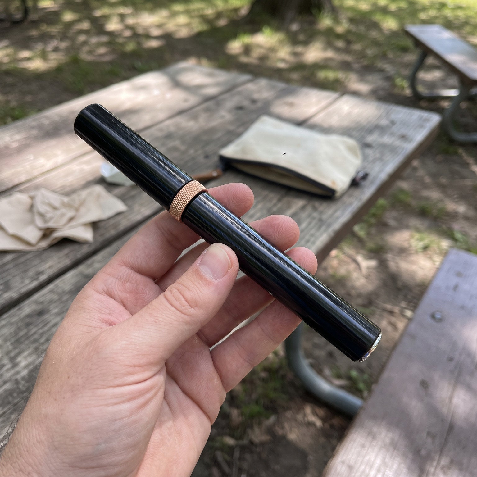 Hands holding a capped Red Openvale opener